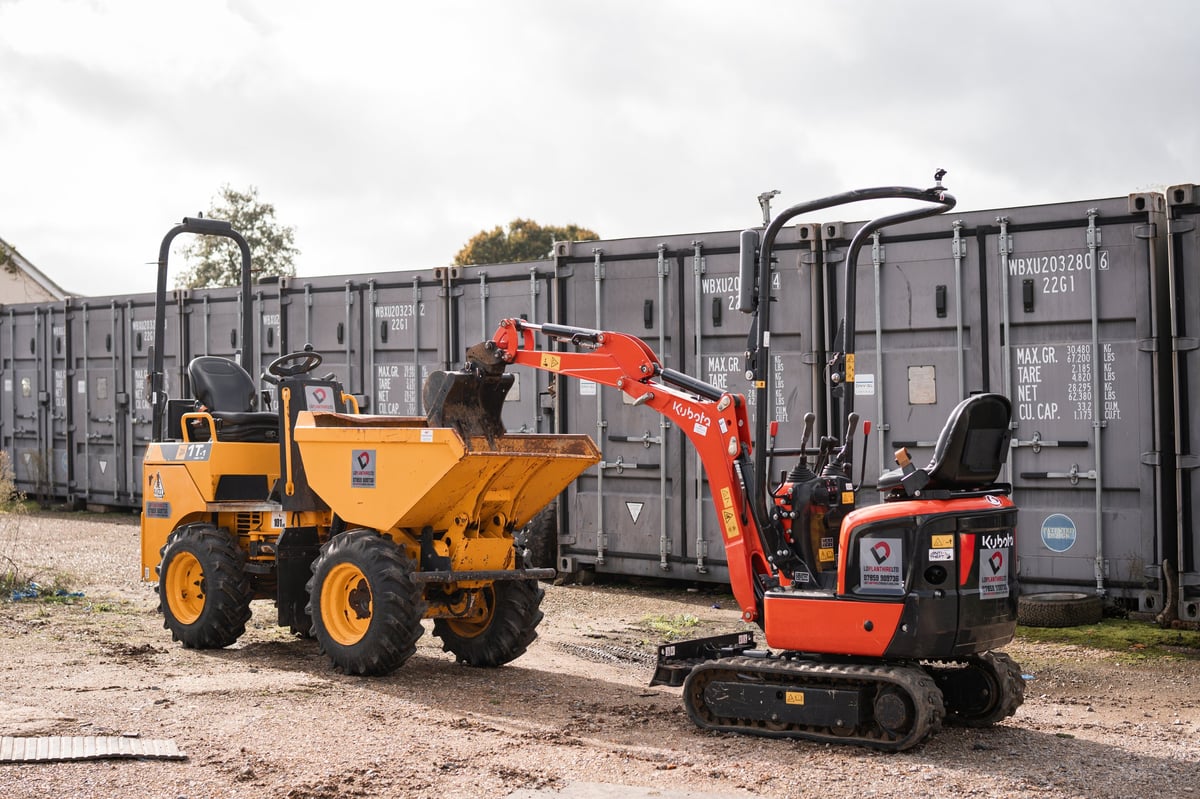 Yellow articulated hauler and red mini excavator parked at the LD Plant Hire yard